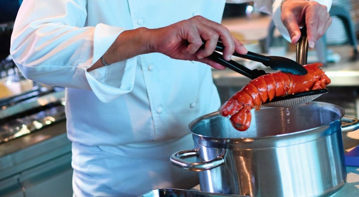 Man cooking lobster with matferbourgeat pot